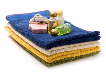 Towels, shampoo bottles and pumice stones
