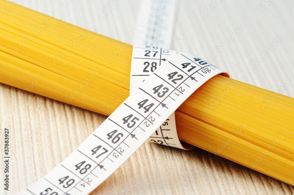 Wall mural diet concept, spaghetti with measuring tape