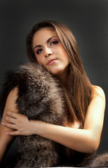 portrait of pretty young woman in fur