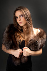 portrait of pretty young woman in fur