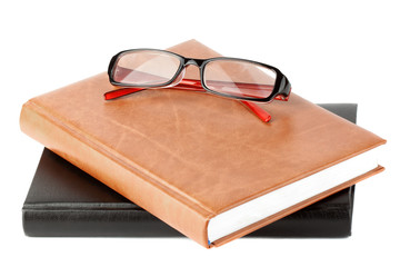 Books stack with eyeglass