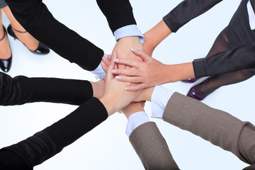 Closeup of successful business women with their hands together