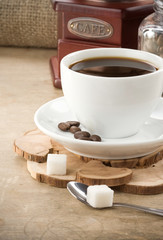 cup of coffee, pot and grinder
