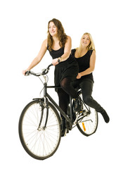 Fototapeta na wymiar Girls on bicycle
