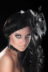 Brunette girl with a hat on his head