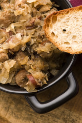 traditional polish sauerkraut (bigos) with mushrooms and plums f