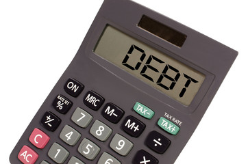 Old calculator on white background showing text "debt" in perspe