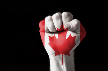 Fist painted in colors of canada flag