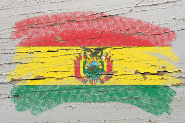 flag of bolivia on grunge wooden texture painted with chalk