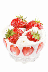 Vase of strawberries with cream