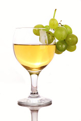 Grape on glass of white wine