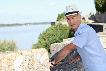Man on the ramparts overlooking the river