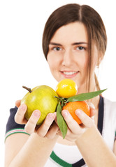 Young beautiful woman holding fresh fruits