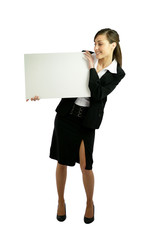 Woman in suit holding white panel