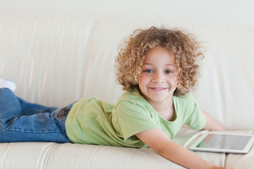 Smiling boy using a tablet computer