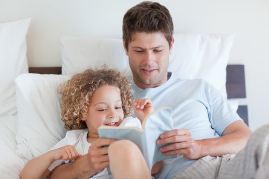 Father Reading A Story For Child