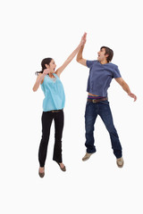 Obraz premium Portrait of a couple jumping together