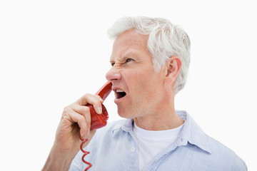 Angry man making a phone call