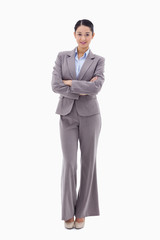 Portrait of a brunette businesswoman with the arms crossed