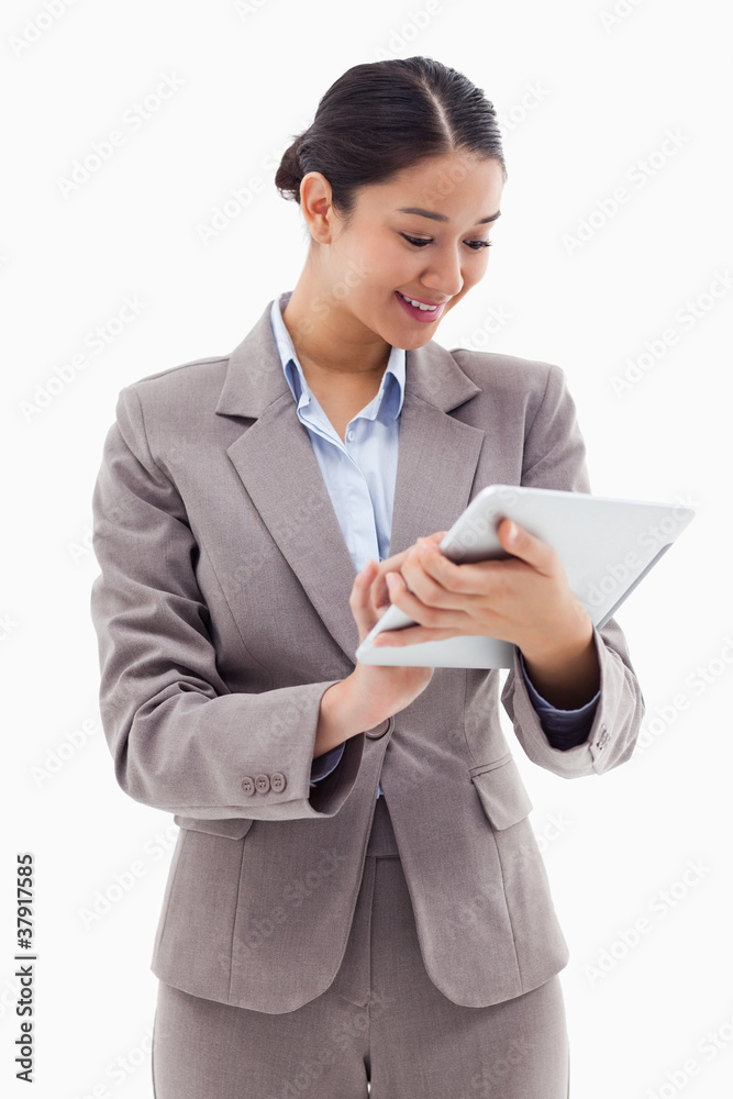 Poster portrait of a businesswoman using a tablet computer