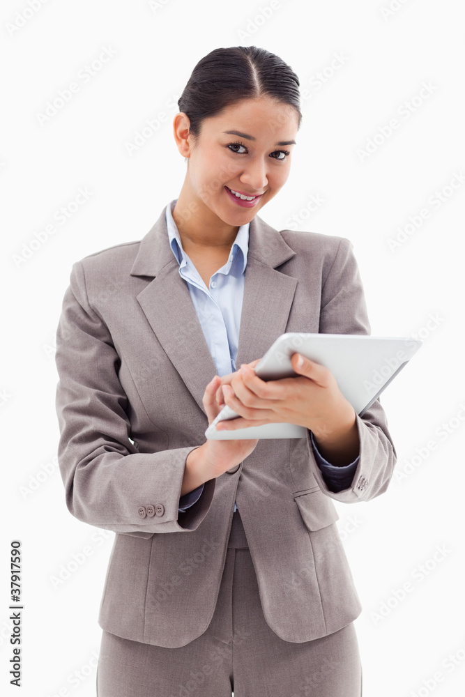 Poster portrait of a smiling businesswoman using a tablet computer