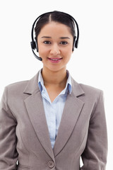 Portrait of a smiling operator posing with a headset