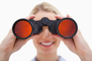 Woman looking through binoculars