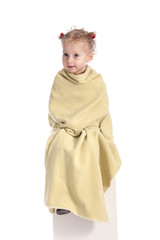 little girl wrapped in a blanket