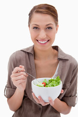 Smiling woman with bowl of salad