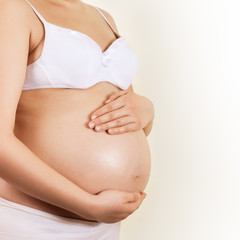 Pregnant woman take care about her belly