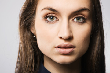 Obraz premium Beautiful fashion model in strict blue dress