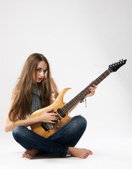 Fototapeta premium Beautiful girl with electric guitar