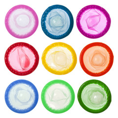 Colorful condoms isolated on white background - obrazy, fototapety, plakaty