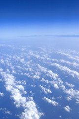 Fototapeta na wymiar blue sky clouds view from aircraft airplane sunny day