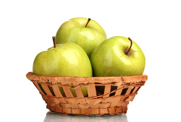 juicy green apples in basket isolated on white
