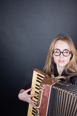 Girl with accordion and glasses