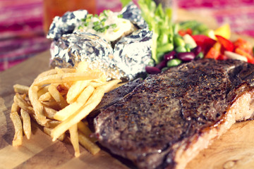 sirloin steak, close up dish of sirloin steak with fries.