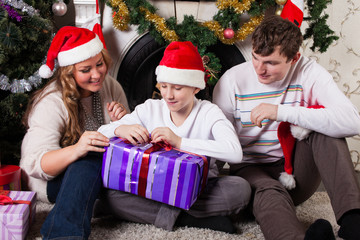 Obraz na płótnie Canvas Happy family with Christmas gifts.