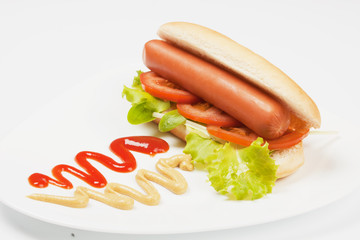 Hot dog with lettuce and mustard