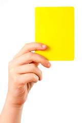 Gelbe Karte in der Hand