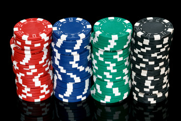 poker chips over black background
