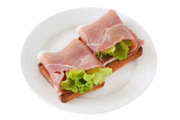 toasts with prosciutto and lettuce
