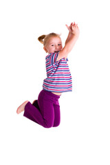 studio shot of young girl jumping