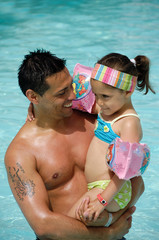 Man and child in pool