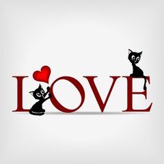 word "LOVE" with two black kittens