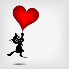 black kitty holding big red heart