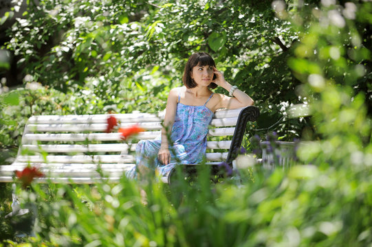 Relaxing young woman in a park