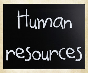 The word 'Human resources' handwritten with white chalk on a bla