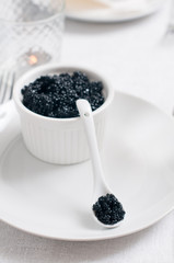 Fototapeta na wymiar Black caviar in a bowl