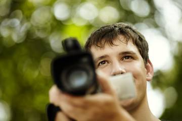 young man with camcorder